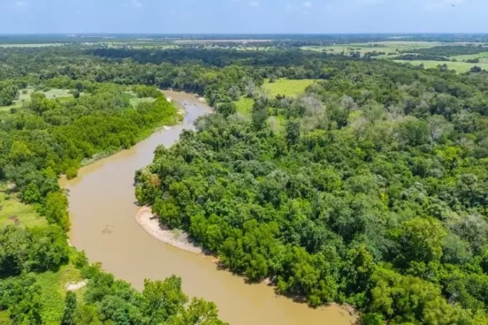 flowing river through a lush rangeland